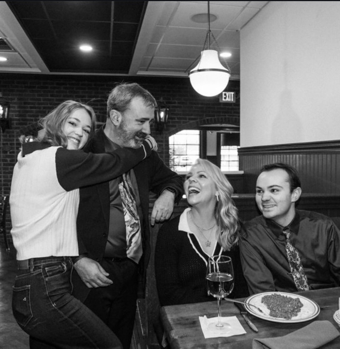 Karys with her family at a restaurant