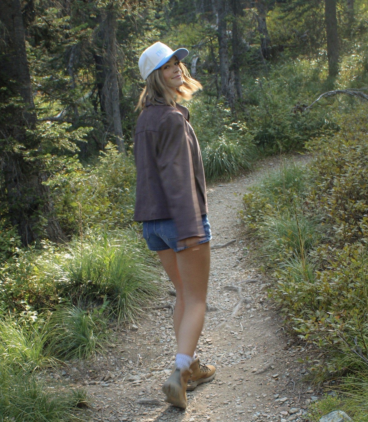 Karys standing on a hiking trail