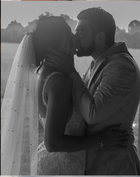 Kaitlyn and Patrick kissing in their wedding attire
